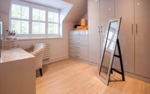 Free-standing full-length mirror in a bright dressing room
